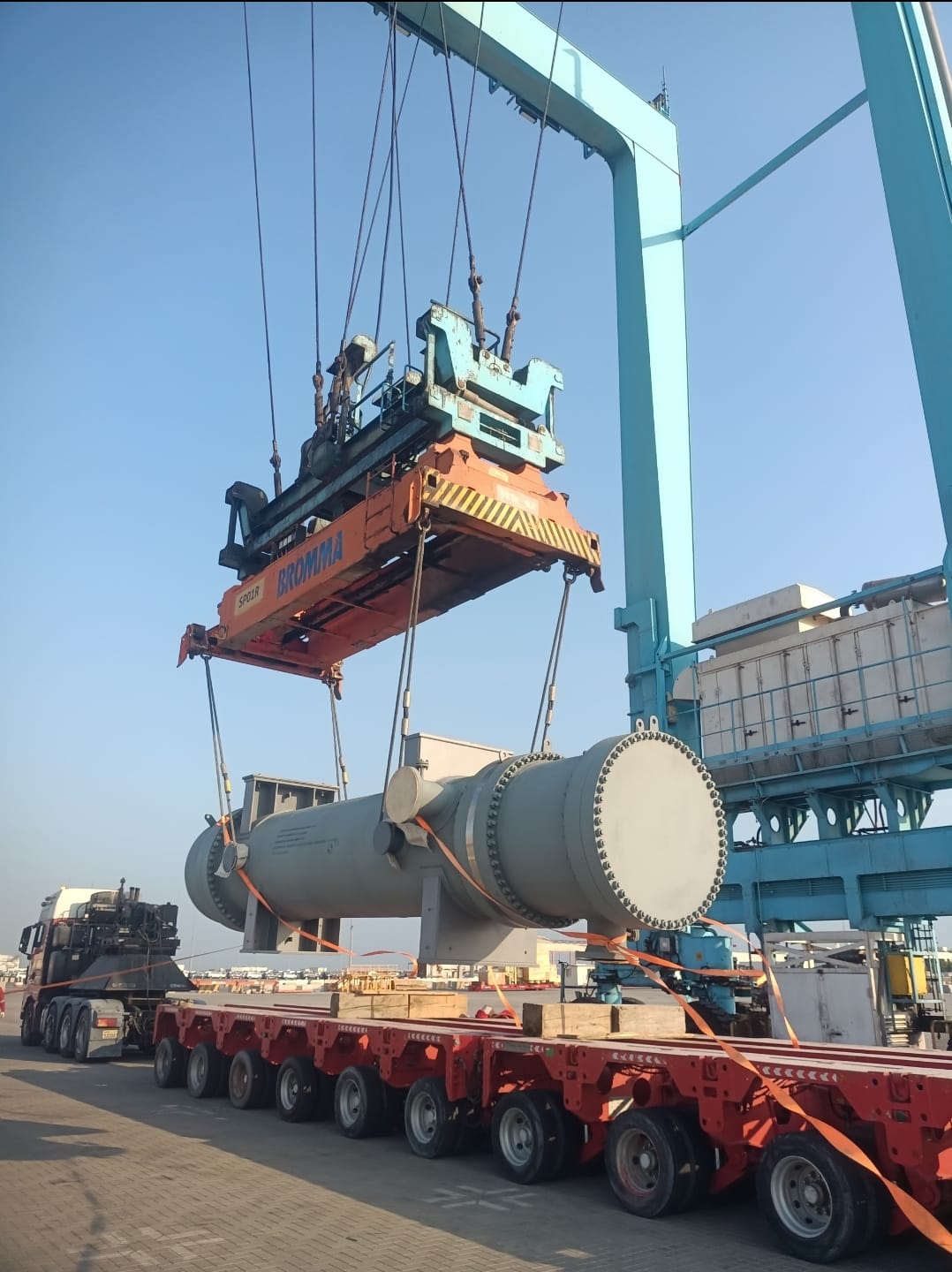 Gantry crane lifting a heat exchanger at a port yard